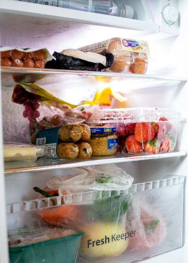 a refrigerator with fruits and veggies